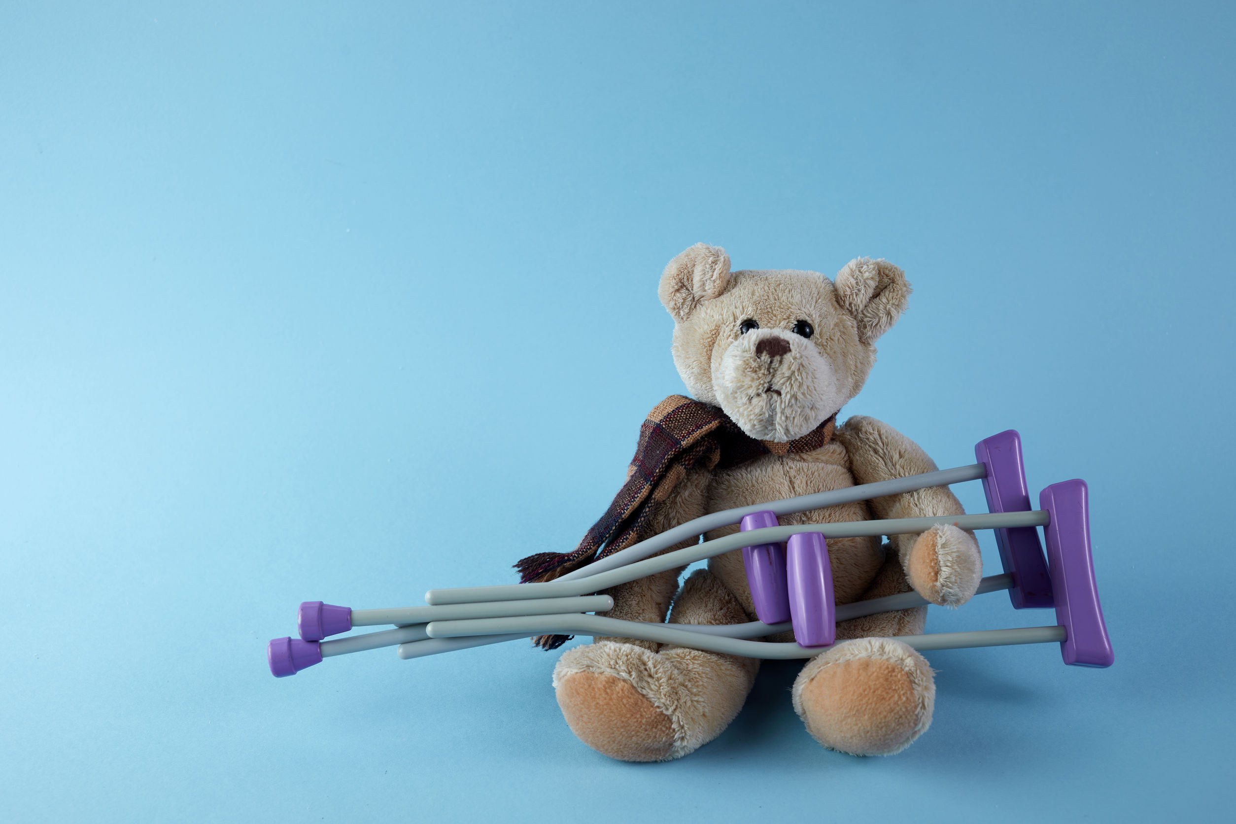 teddy bear on crutches with cast